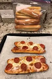 Olive Garden secret menu breadstick pizza with Alfredo and toppings